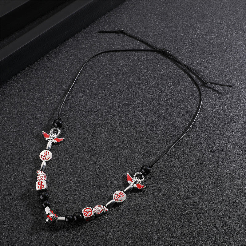 Venta al por mayor aleación Smiley Skull Angel collar de perlas negras